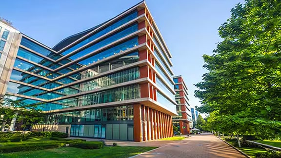 An office building surrounded by greenery
